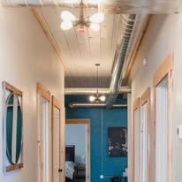 Hallway with globe ceiling lights